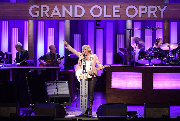 Anita Cochran performing with guitar at the Grand Ole Opry, 2019
